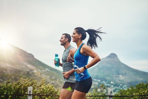 Shot of a young attractive couple training for a marathon outdoors.